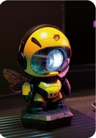 Yellow bee-style astronaut Sky Projector figure standing on a surface with illuminated visor lens.
