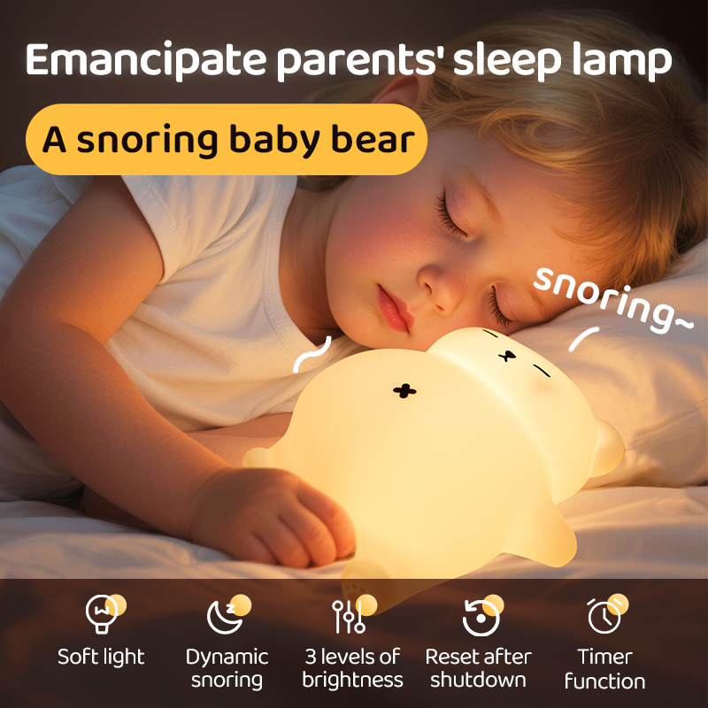 Young girl holding a warm, glowing silicone bear toy with a sleeping face design, while a parent works on a laptop nearby.